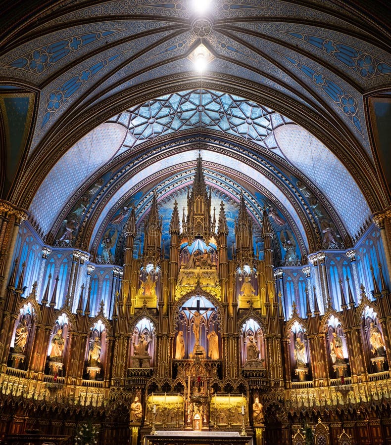 The ornate altar with statues in niches surrounding it and blue arched ceiling with geometric designs. The ornate altar with statues in niches surrounding it and blue arched ceiling with geometric designs.