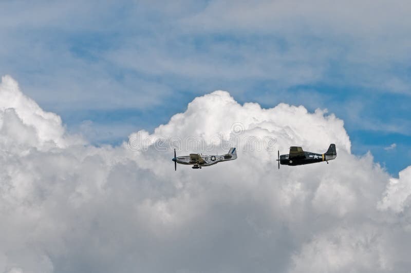 EDEN PRAIRIE MN - JULY 16 2016: P-51 Mustang Sierra Sue II and FM-2Wildcat at air show. Used primarily in WWII the Mustang was a long-range fighter while the Wildcat was involved in convoy protection. EDEN PRAIRIE MN - JULY 16 2016: P-51 Mustang Sierra Sue II and FM-2Wildcat at air show. Used primarily in WWII the Mustang was a long-range fighter while the Wildcat was involved in convoy protection.