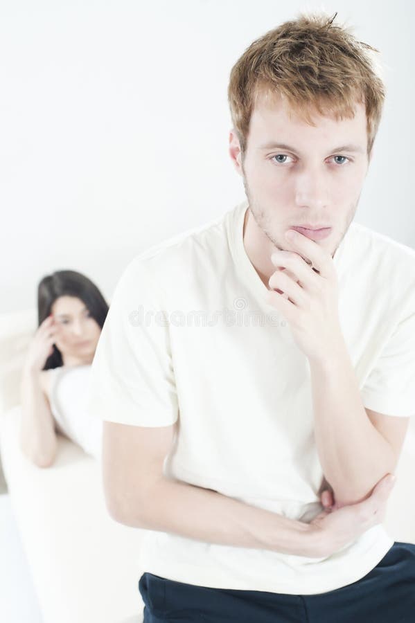 Young couple going through serious problems (portrait orientation). Young couple going through serious problems (portrait orientation)