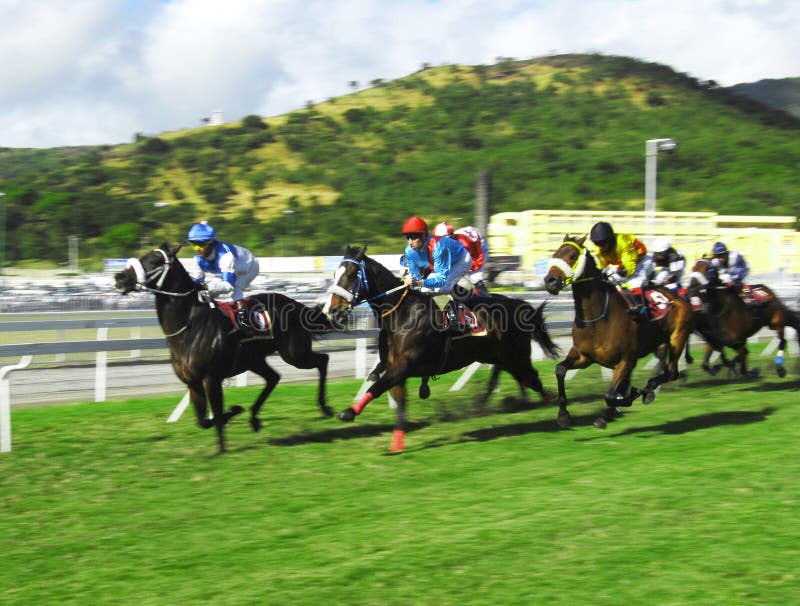 Typical horse race in Port Louis, every Saturday at the Champs de Mars, landmark race track in Mauritius with international jockeys participating. Typical horse race in Port Louis, every Saturday at the Champs de Mars, landmark race track in Mauritius with international jockeys participating