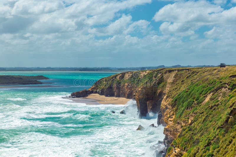 Pacific Ocean waves crashing the cliffs in Otago, New Zealand. Waves crashing cliffs stock images, royalty-free photos and pictures
