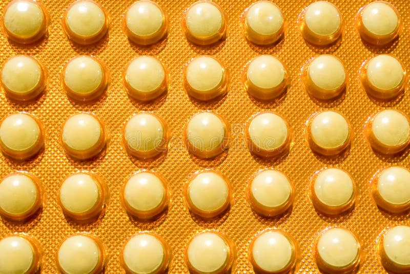 Pack of yellow pills stock image. Image of small, round 15029419