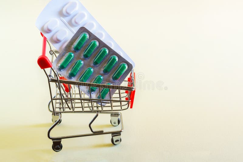Packages of medicines in a shopping cart. Purchase of antiviral and anti-inflammatory drugs. Copy space royalty free stock photos Packages of medicines in a shopping cart. Purchase of antiviral and anti-inflammatory drugs. Copy space royalty free stock photos