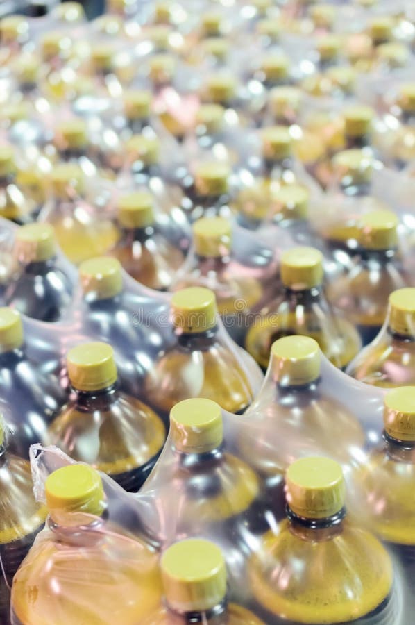 Packaging Many Plastic Bottles at the Brewery. Stock Photo Image of