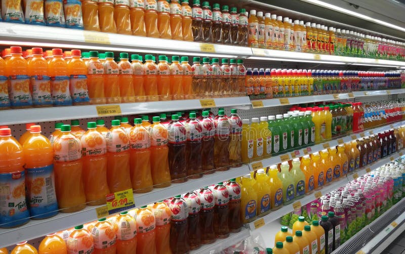 Packed and bottle of juice drink display on refrigerated rack in supermarkets.