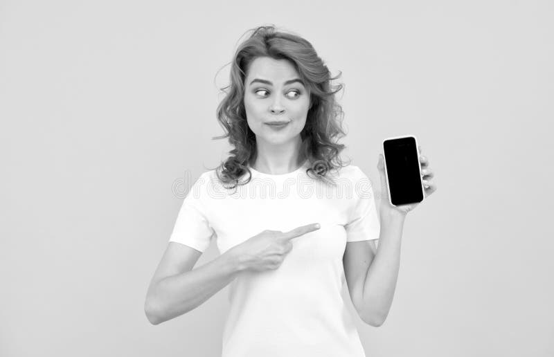 Packed with features. pointing finger cell phone. show mobile device. presenting product royalty free stock images