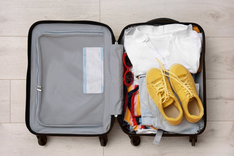 Packed Suitcase with Clothes and Sneakers Stock Photo Image of