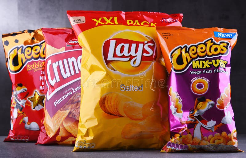 Packets of popular brands of snack food. POZNAN, POLAND - JUN 15, 2018: Packets of popular brands of snack food including Lays, Crunchips and Cheetos stock photos Packets of popular brands of snack food. POZNAN, POLAND - JUN 15, 2018: Packets of popular brands of snack food including Lays, Crunchips and Cheetos stock photos