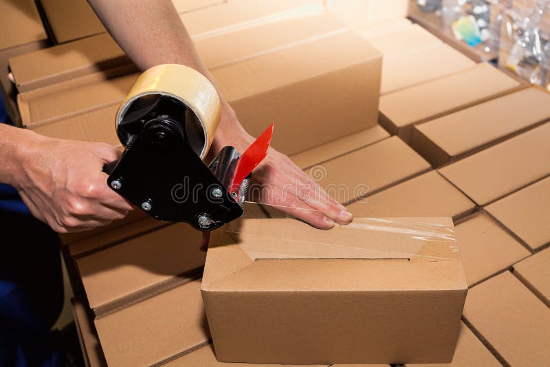 Packing a carton boxes stock photo. Image of equipment - 33434420