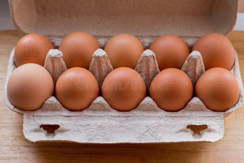 Packing Eggs in a Cardboard Box on the Table Stock Image Image of