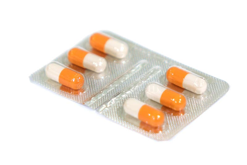 packs of medical capsules on white background