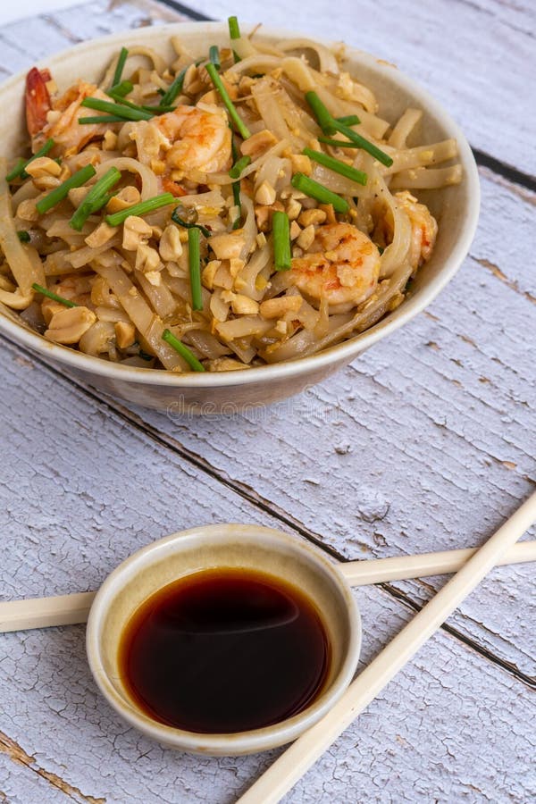 Pad Thai Rice Noodles with Prawns and Peanuts. Typical Thai Food Stock