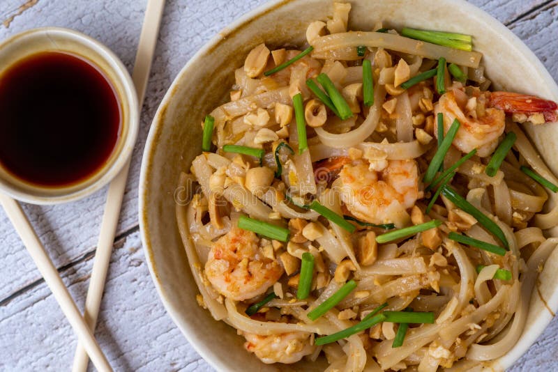Pad Thai Rice Noodles with Prawns and Peanuts. Typical Thai Food Stock