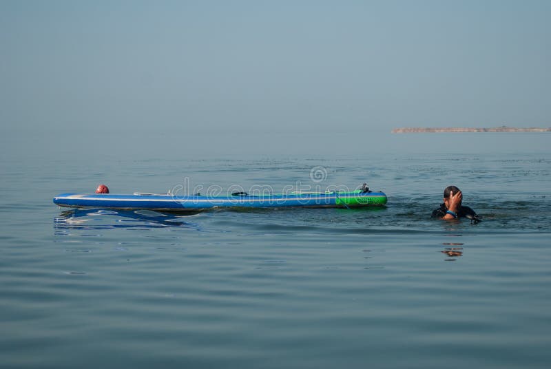 Paddle Board chill out, man overboard, water accident, royalty free stock images Paddle Board chill out, man overboard, water accident, royalty free stock images