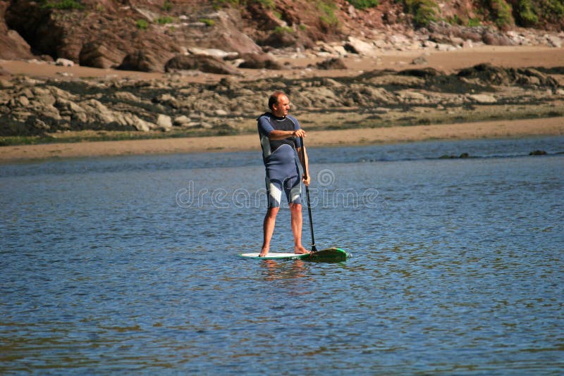 Man on Paddleboard in Dana Point Harbor, California. Editorial