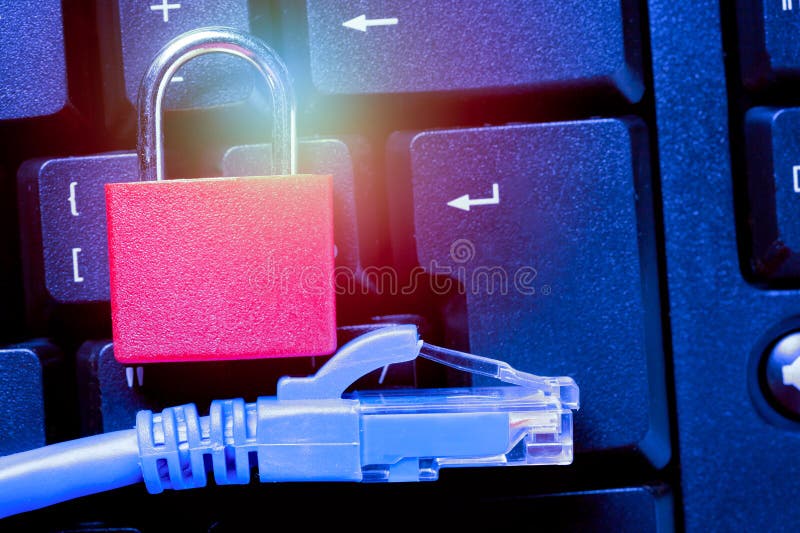 Padlock with ethernet network cable close up on computer keyboard. Internet data privacy information security concept. Toned stock photo