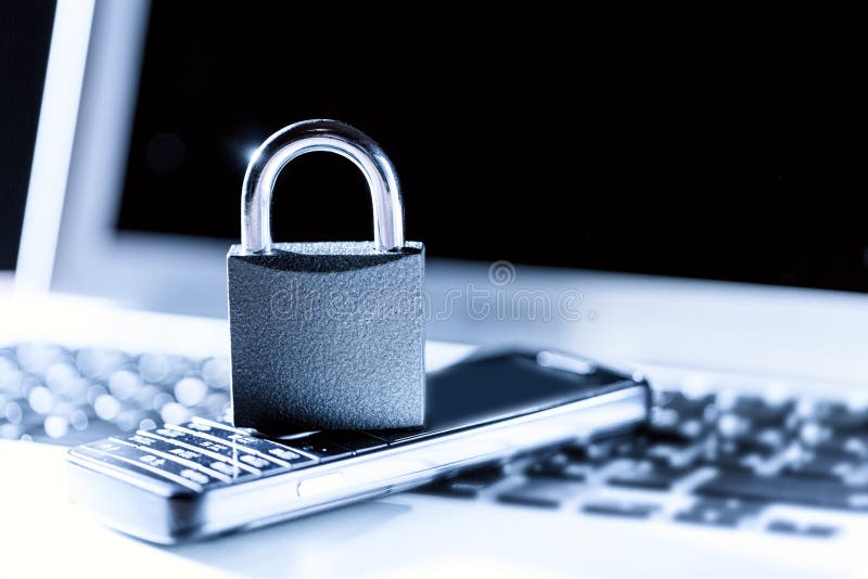 Padlock on Laptop and Old Mobile Phone. Data Privacy Information Security Concept Stock