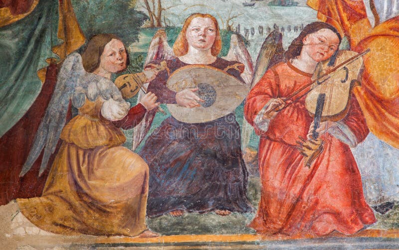 The fresco of angels with the music instruments by Bonino da Campione (14. cent.) in the church of The Eremitani as the detail of on tomb of Umberto da Carrara. The fresco of angels with the music instruments by Bonino da Campione (14. cent.) in the church of The Eremitani as the detail of on tomb of Umberto da Carrara.