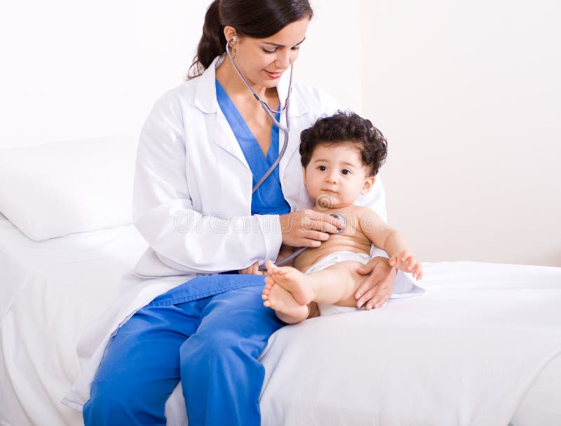 Paediatrician checking baby royalty free stock photo Paediatrician checking baby royalty free stock photo