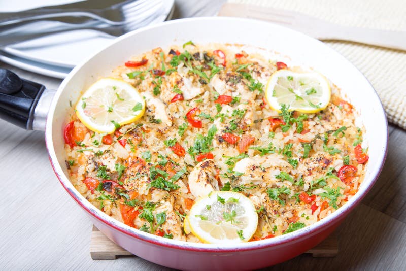 Paella with Chicken, Tomatoes and Pepper . Traditional Spanish Dish