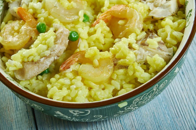 Paella with cod and shrimp stock image. Image of fish 152108043
