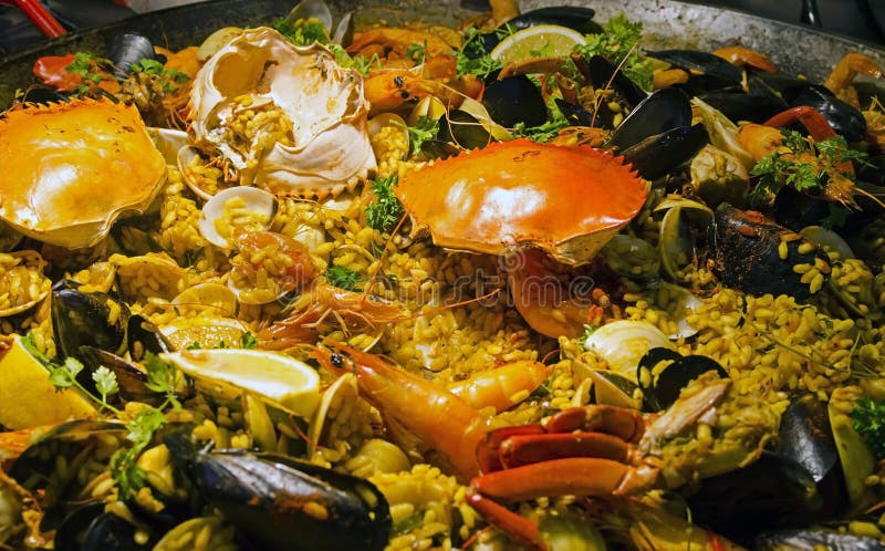 Seafood Paella with prawns, crab, mussels and clams. Seafood Paella with prawns, crab, mussels and clams.