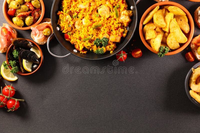 Paella and tapas stock photo. Image of diet, cooked 179258944