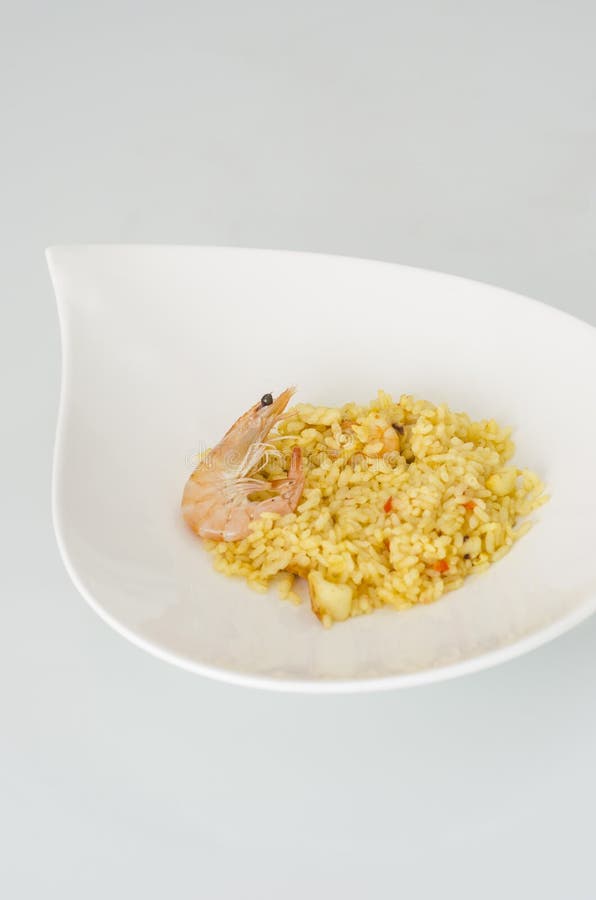 Paella, typical Spanish dish on white background. royalty free stock images Paella, typical Spanish dish on white background. royalty free stock images