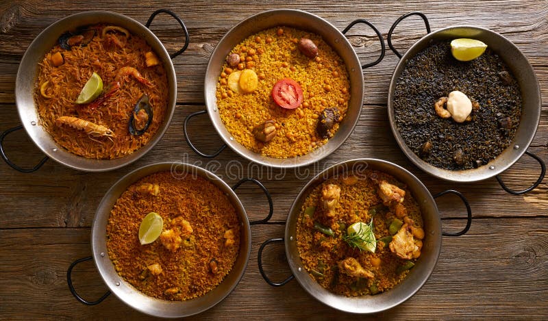 Paelhas cinco receitas de arroz de Espanha fotografia de stock royalty free