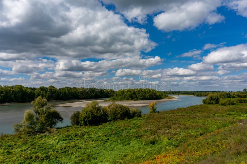 landscape of the Katun River floodplain on a sunny day with light clouds in the sky. Altay, Russia. landscape of the Katun River floodplain on a sunny day with light clouds in the sky. Altay, Russia