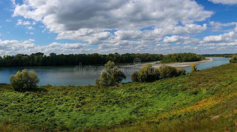 landscape of the Katun River floodplain on a sunny day with light clouds in the sky. Altay, Russia. landscape of the Katun River floodplain on a sunny day with light clouds in the sky. Altay, Russia