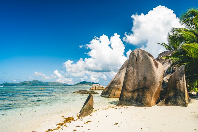 Vacation holiday landscape of La Digue island, Seychelles. Paradise Anse Source d`Argent beach with granite boulders and blue ocean. Vacation holiday landscape of La Digue island, Seychelles. Paradise Anse Source d`Argent beach with granite boulders and blue ocean.