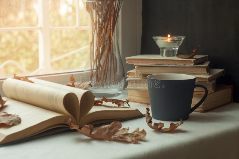 Pages of a book forming the shape of the heart. Passion for reading. hot Cup of tea,a window in the background. Book Heart.