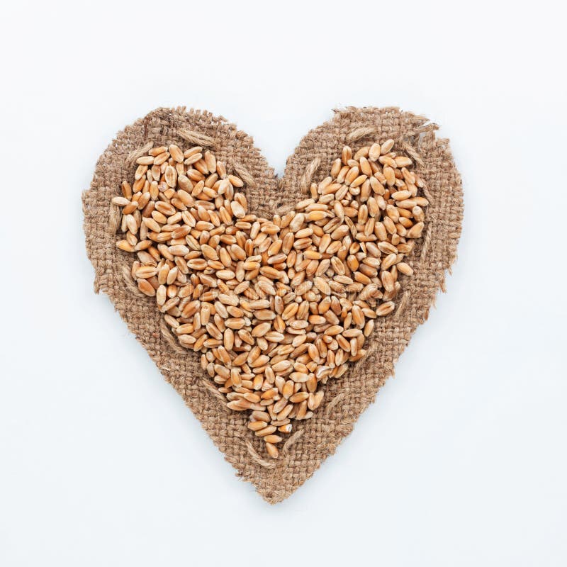 Pagina sotto forma di cuore con grano fotografie stock libere da diritti Pagina sotto forma di cuore con grano fotografie stock libere da diritti