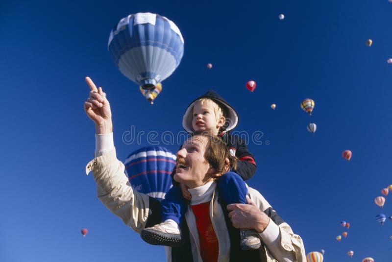 Father with young son on his shoulders, Albuquerque's Hot Air Balloon Festival, New Mexico. Father with young son on his shoulders, Albuquerque's Hot Air Balloon Festival, New Mexico