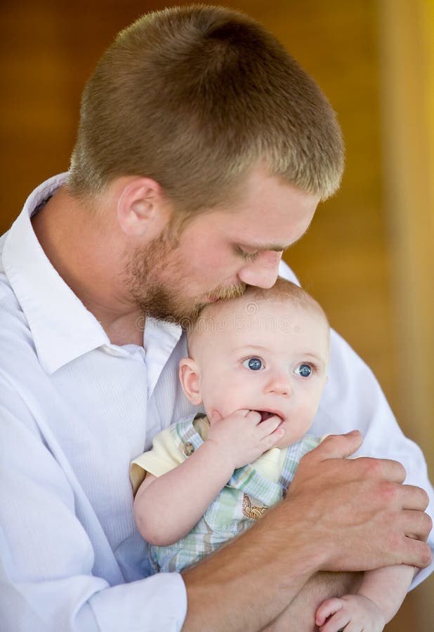 Father Giving a Tender Kiss to Son. Father Giving a Tender Kiss to Son