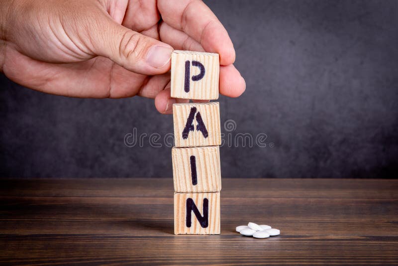 Pain Concept. Wooden Letters And White Pills Stock Photo - Image of