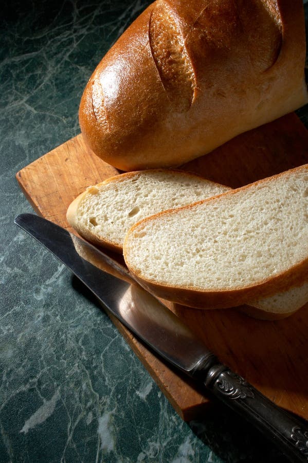 Pain et couteau blancs images libres de droits Pain et couteau blancs images libres de droits