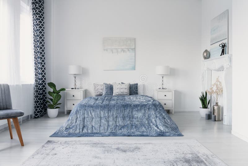 Paining above big comfortable bed in luxury new york style bedroom, real photo stock photo Paining above big comfortable bed in luxury new york style bedroom, real photo stock photo