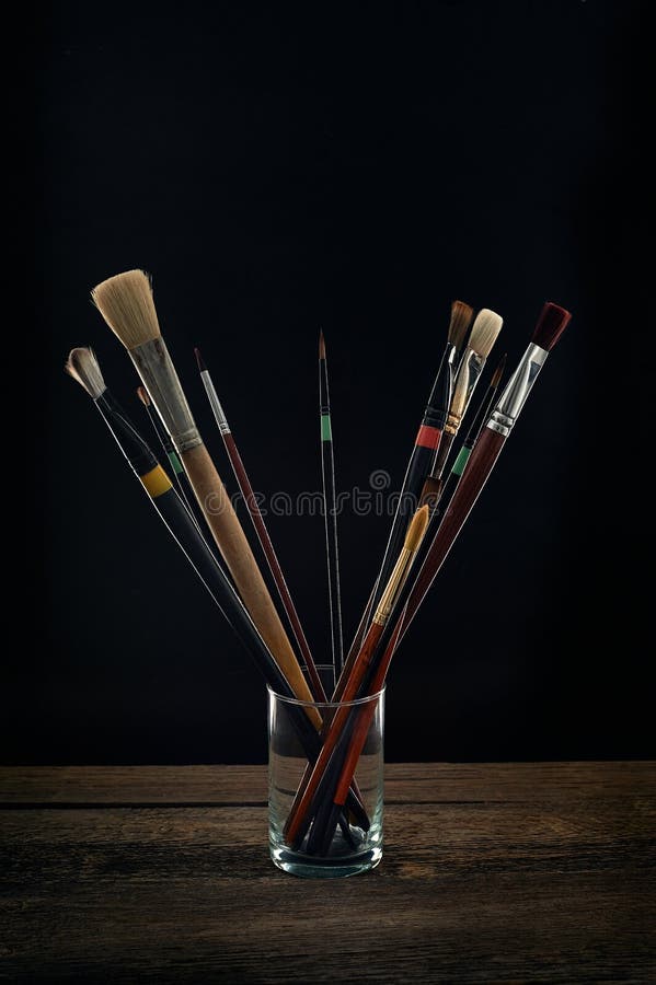 Paint brushes in a glass stock photo. Image of closeup 85207274