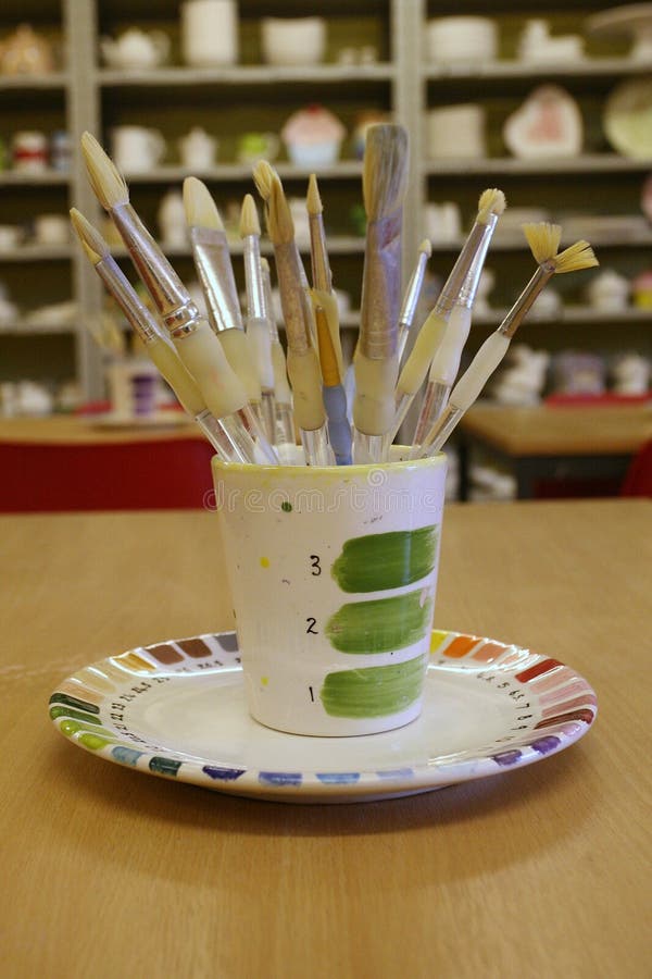 Paint brushes in a pot stock photo. Image of clay, paint 32775580