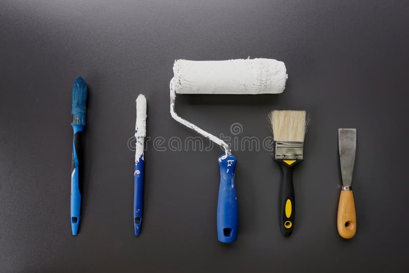 Paint Brushes, Roller and Tools for House Painting on Black Background