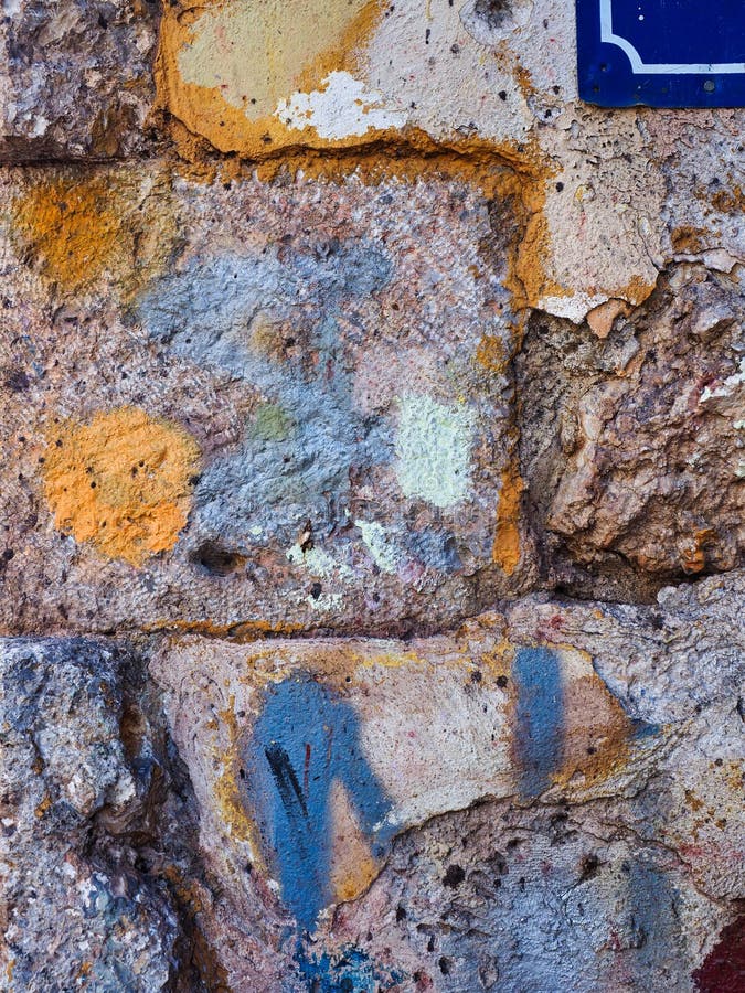 Paint Daubs on Rough Stone Blocks in Old House Wall