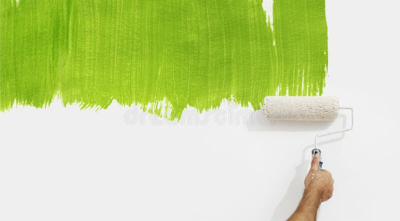 Paint roller hand painting green color isolated on blank wall stock images Paint roller hand painting green color isolated on blank wall stock images