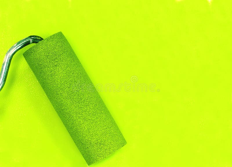 Paint Roller Leaving Stroke of Yellow Color Over a White Background