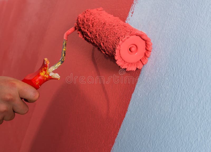 Paint roller on the wall. royalty free stock photos