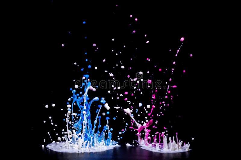 This is a colorful paint splash on a audio speaker isolated on a black background. This is a colorful paint splash on a audio speaker isolated on a black background.