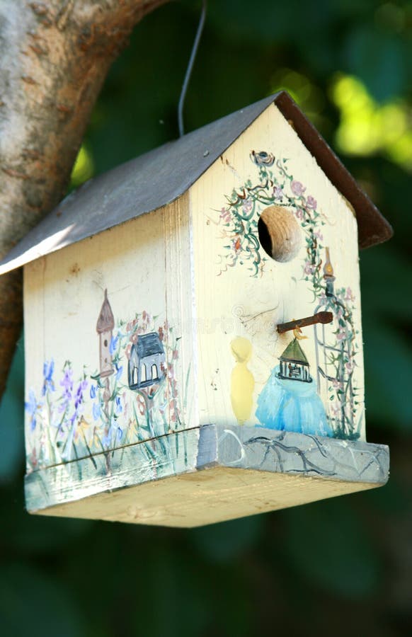 Painted birdhouse in tree stock image. Image of hanging 13944093