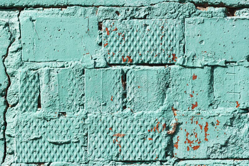 Painted Brick Wall, Peeling Paint, Bright Turquoise Color Stock Photo