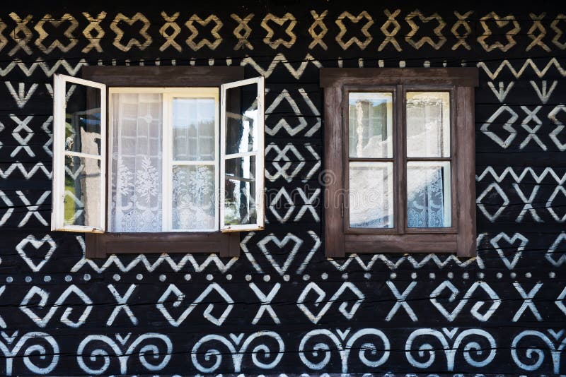 Painted decorations on wall of log house in Cicmany, Slovakia